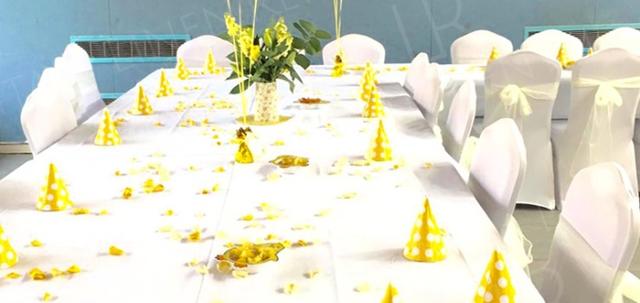 Birthday Party https://d1hcs5uofxldvl.cloudfront.net/linen-rental/article_additional/birthday-party/birthday-party-740x350.jpg - White tablecloths and fitted chair covers complemented by bright yellow accessories.